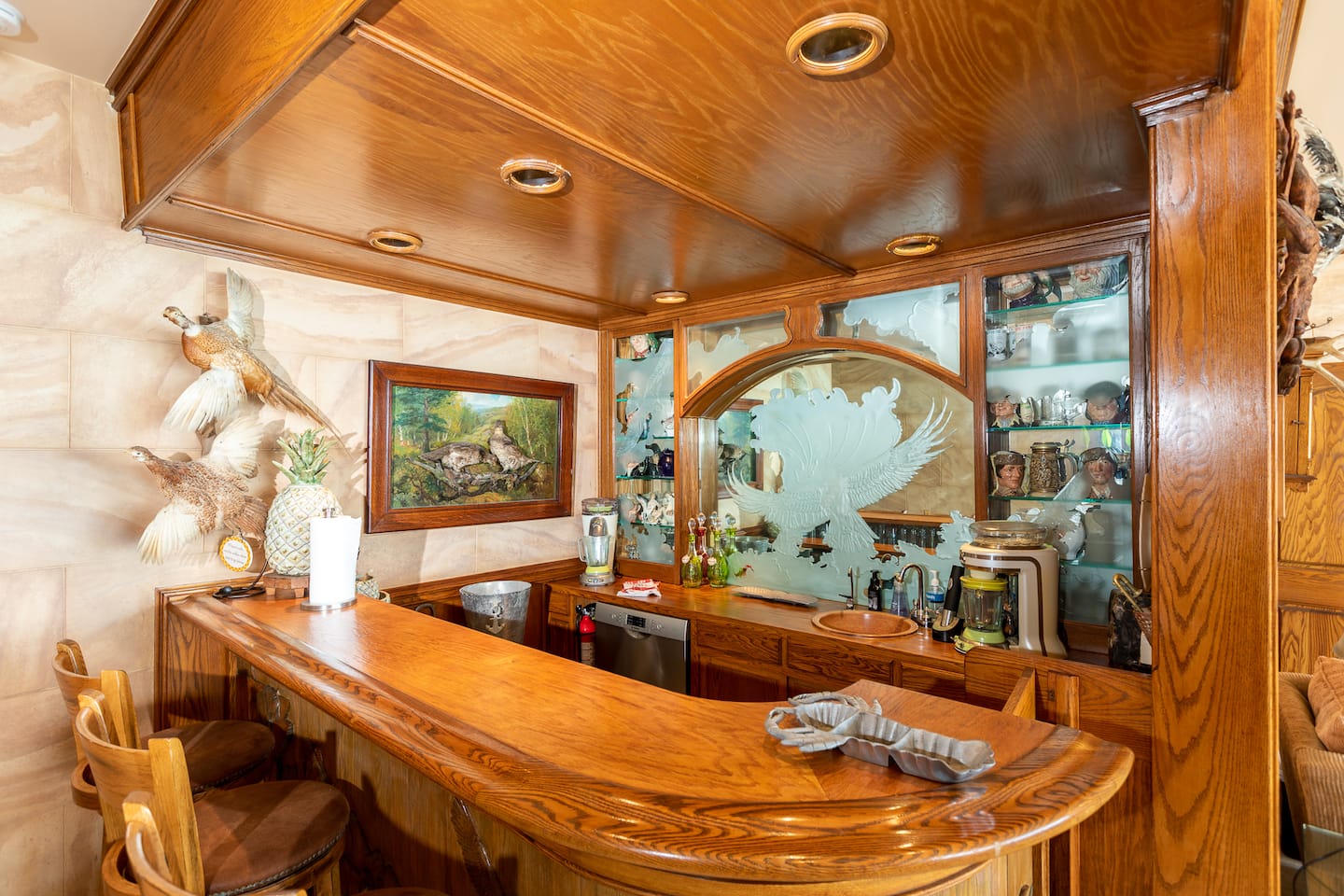 Hand-carved oak wet bar in the den